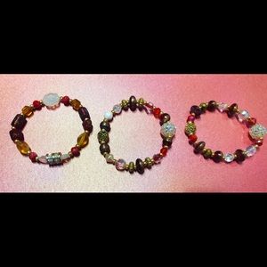 Holiday bracelets.Lots of crystals and charms.